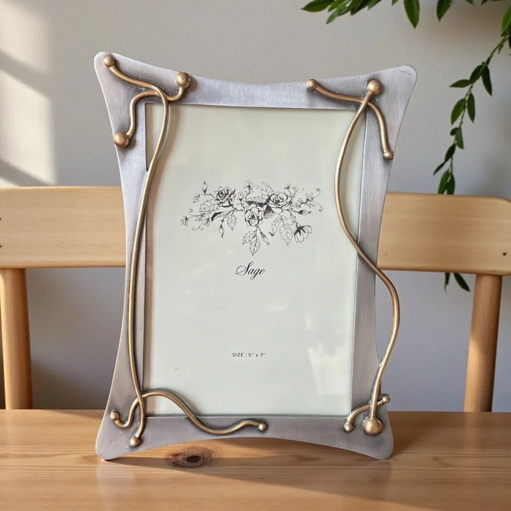 Sage metal photo frame for a 5x7 inch photo, some damage to the stand